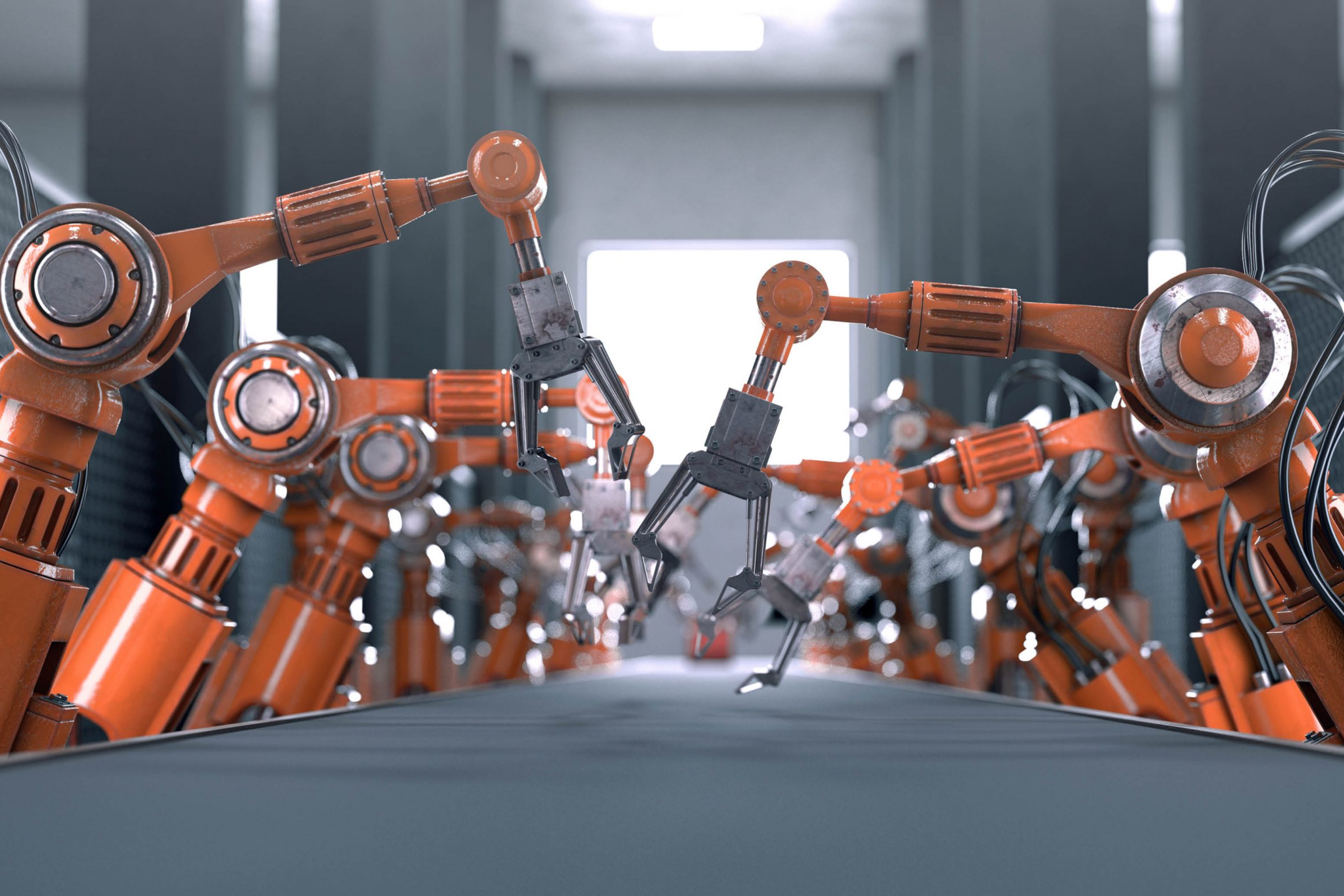 Rows of orange robotic arms working above an empty conveyor belt in a factory setting.