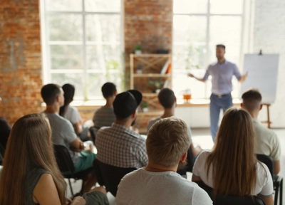 Class of people taking part in corporate training Class of people taking part in corporate training