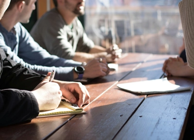 people sitting around table studying people sitting around table studying