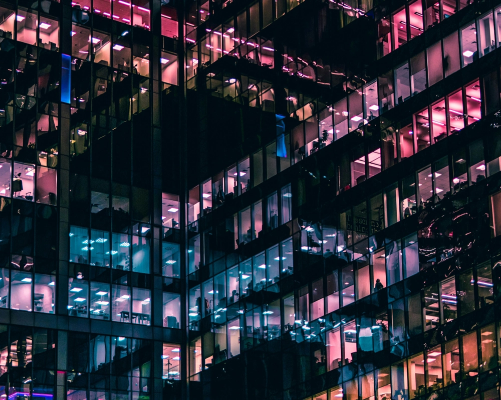 Outside of media building in dark with purple lights Outside of media building in dark with purple lights