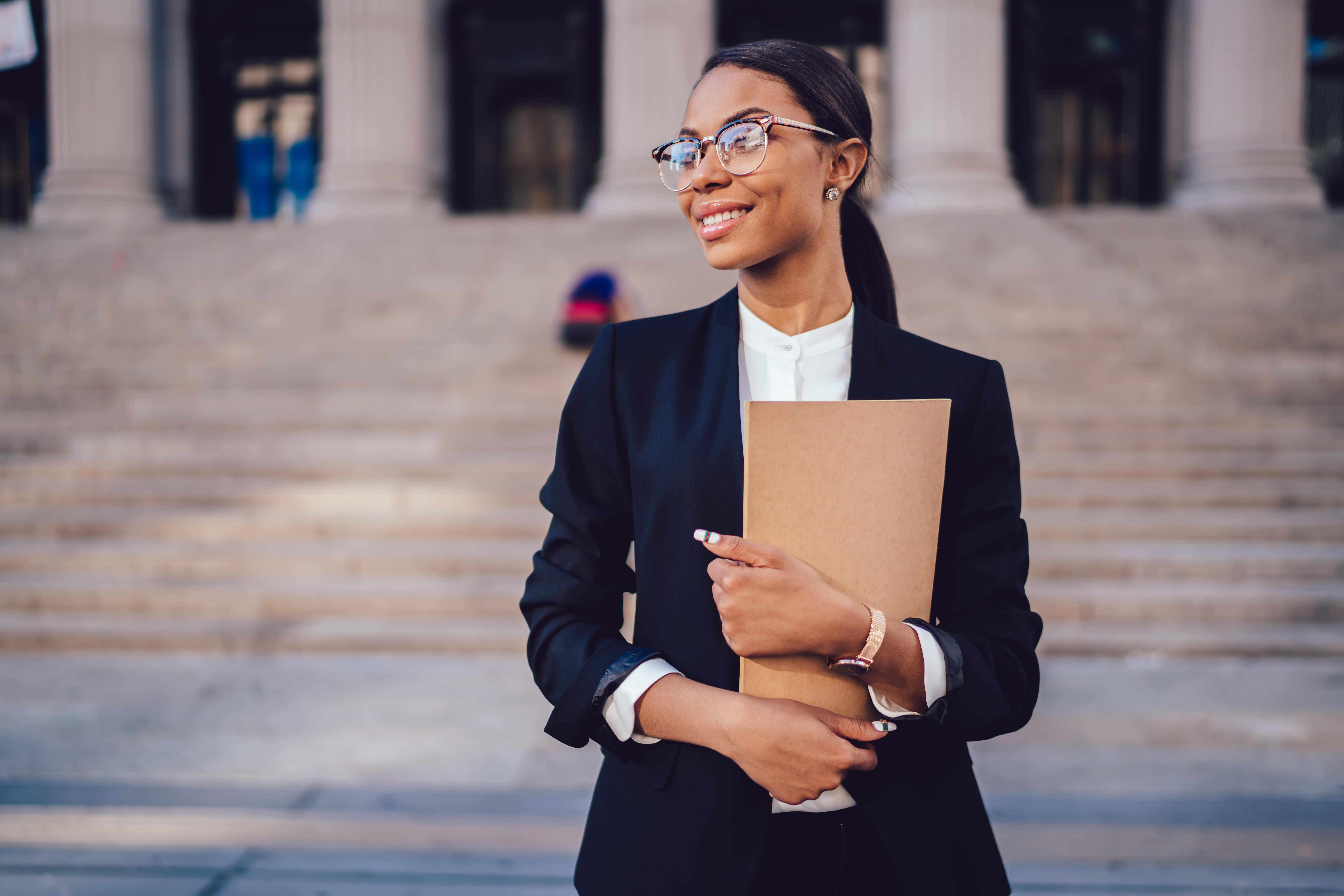 Young professional holding papers