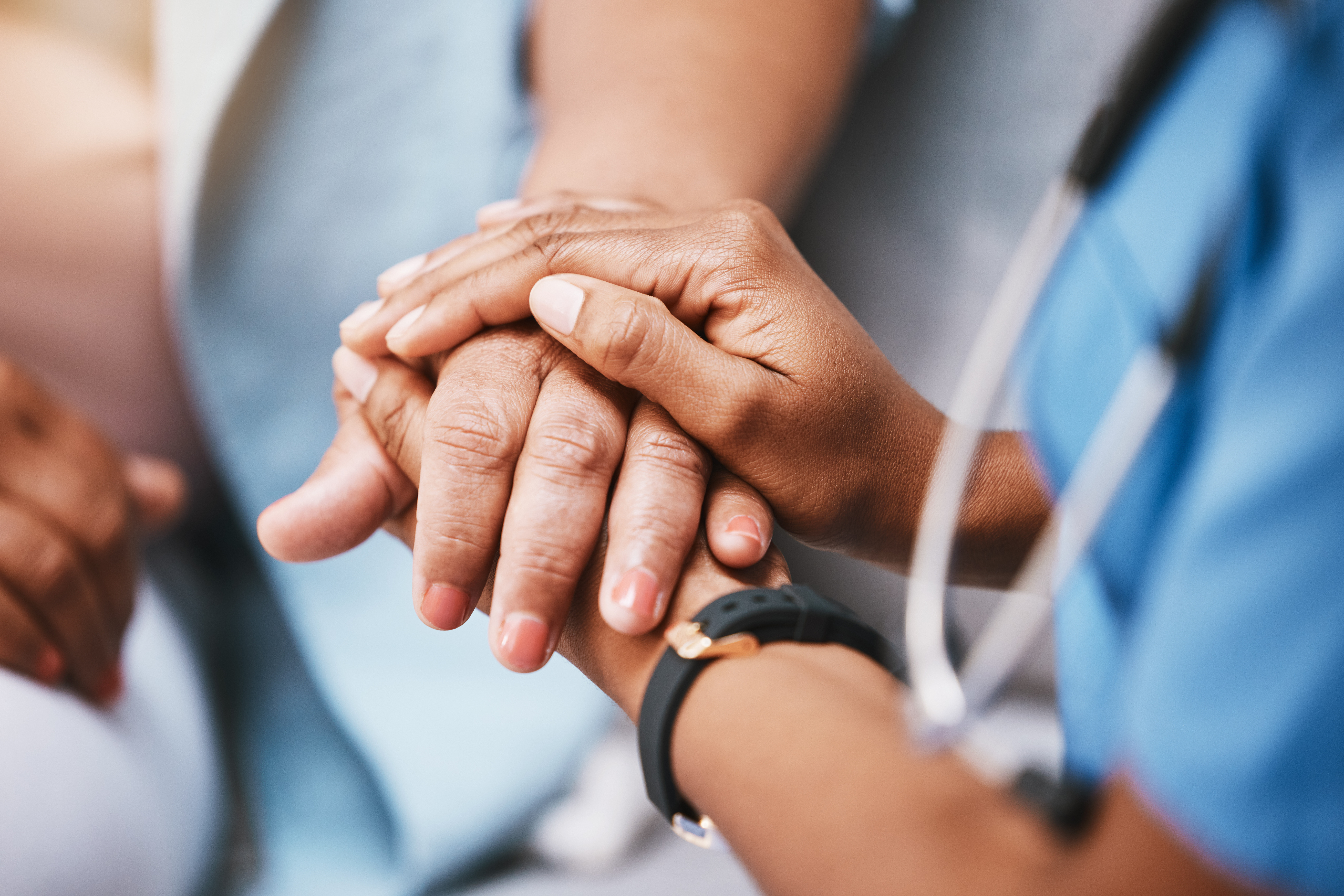 Healthcare provider holding hands