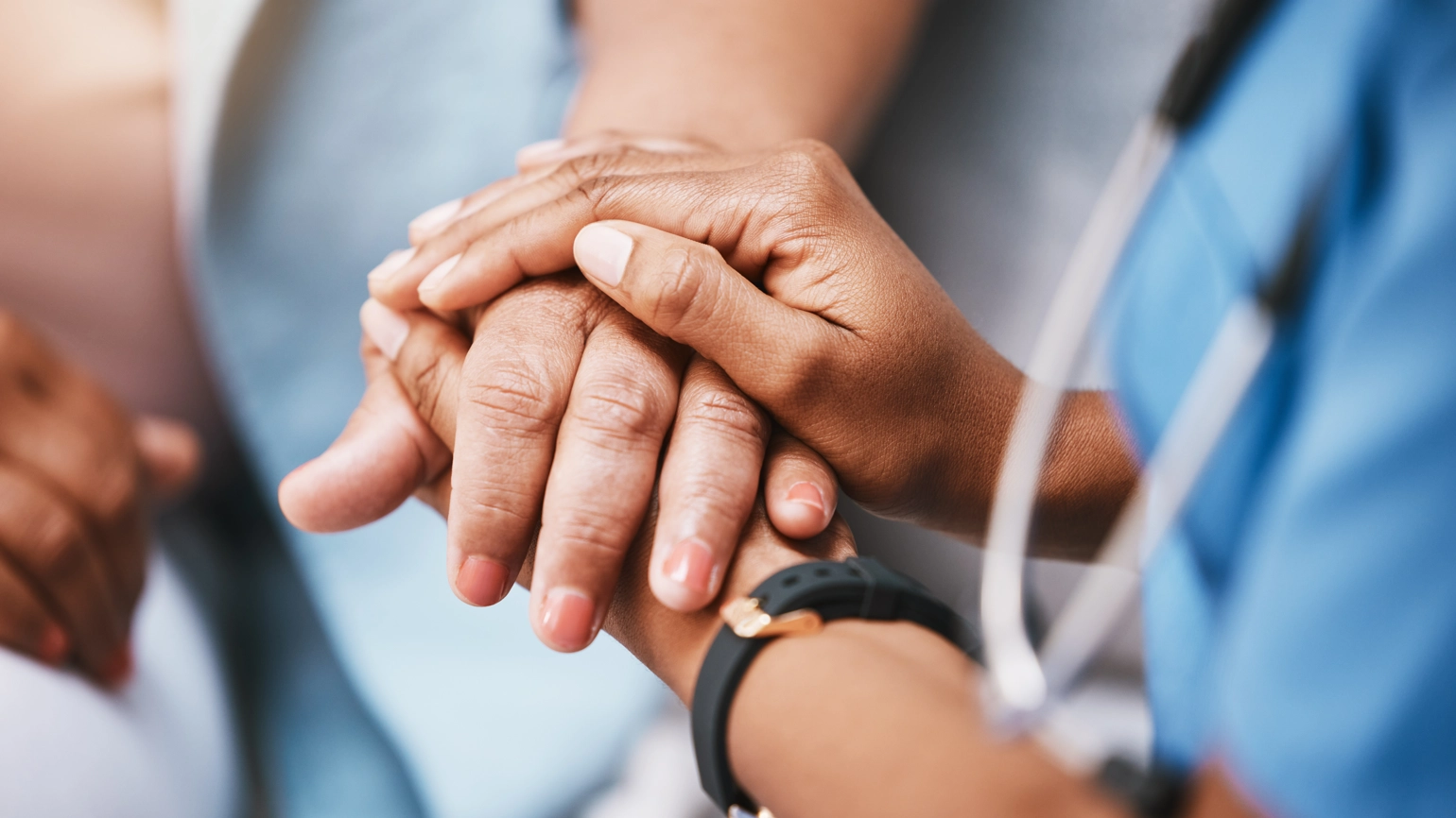 Healthcare provider holding hands Healthcare provider holding hands