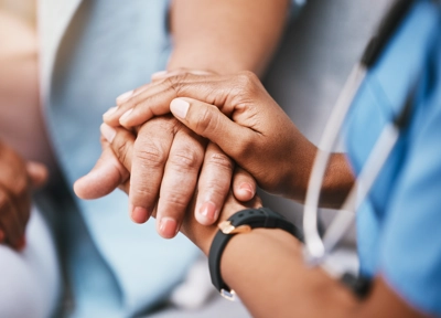 Healthcare provider holding hands Healthcare provider holding hands