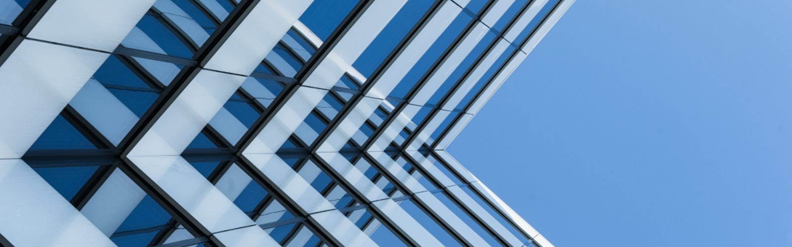 Glass skyscraper and blue sky Glass skyscraper and blue sky