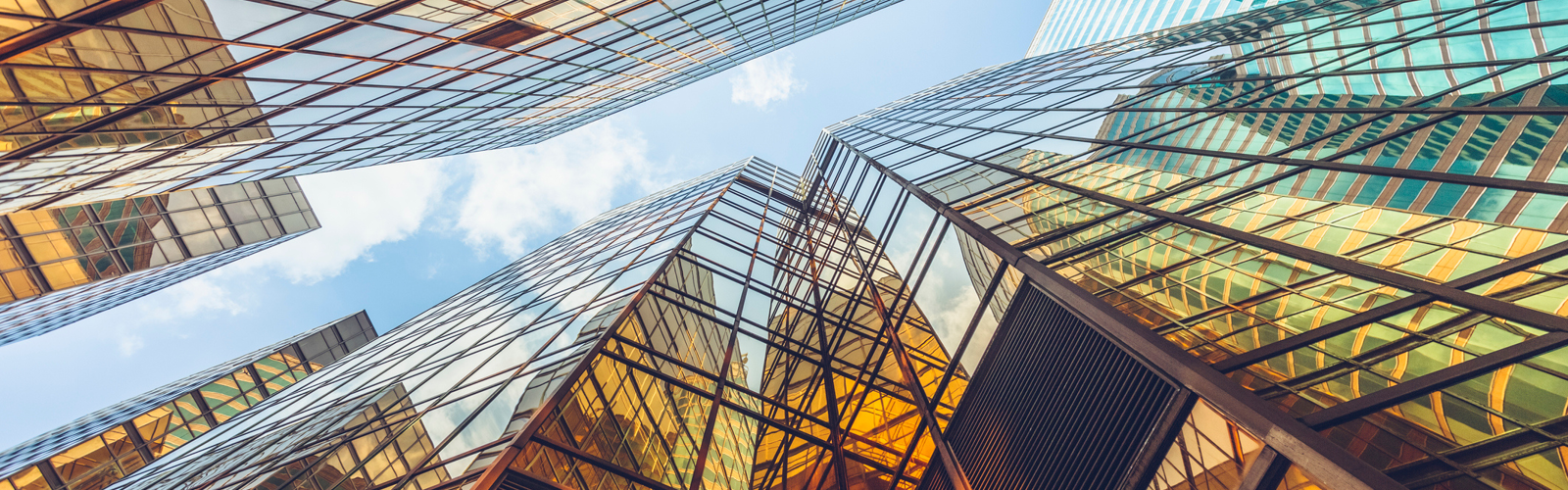 Glass skyscrapers and blue sky Glass skyscrapers and blue sky
