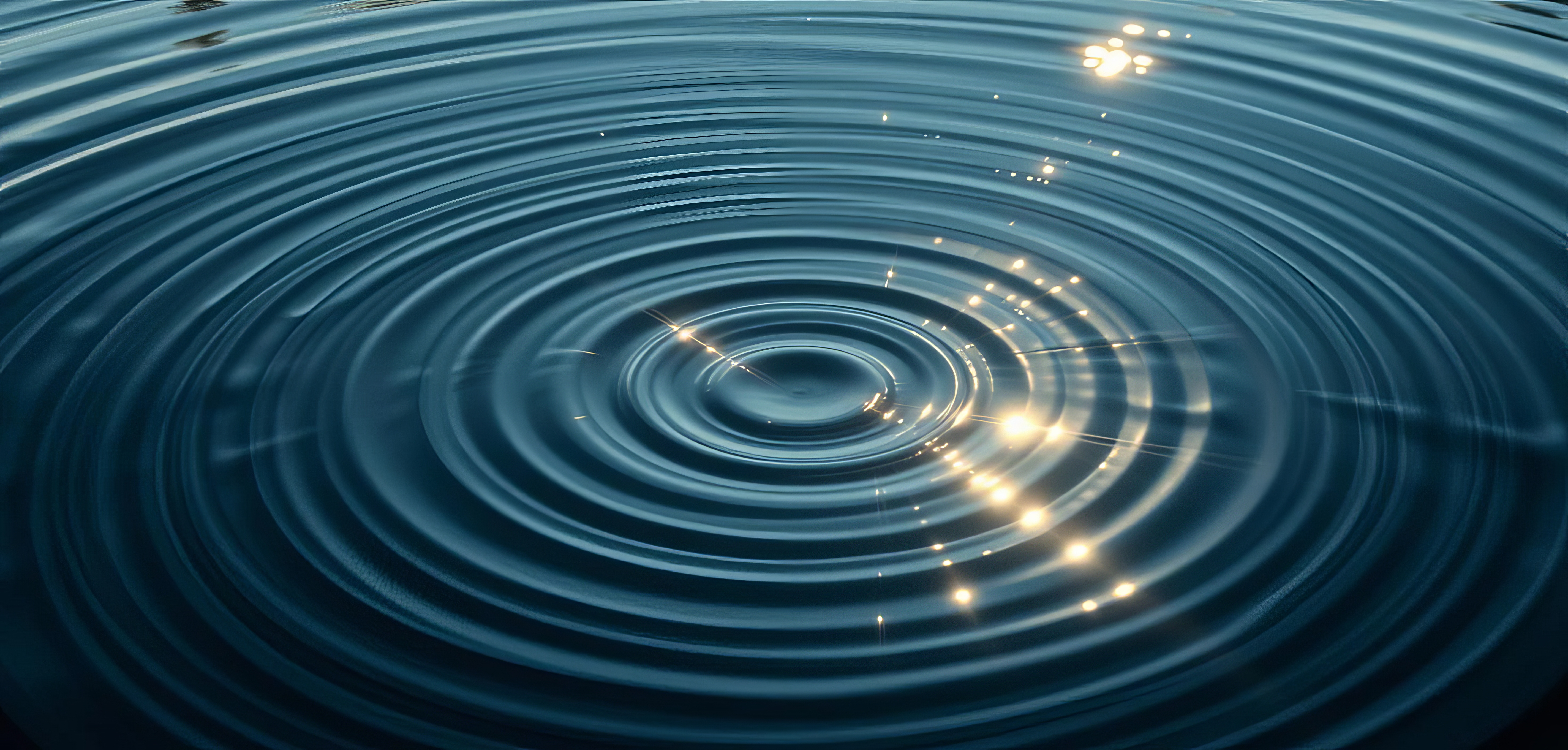 water droplet causing circles in water