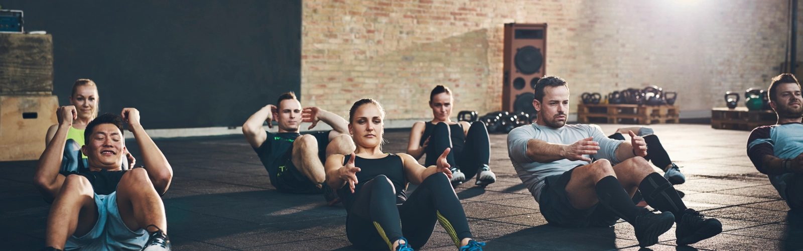People in gym doing workout class People in gym doing workout class