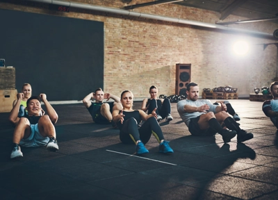 People in gym doing workout class People in gym doing workout class