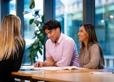 CIL employees sitting around table CIL employees sitting around table