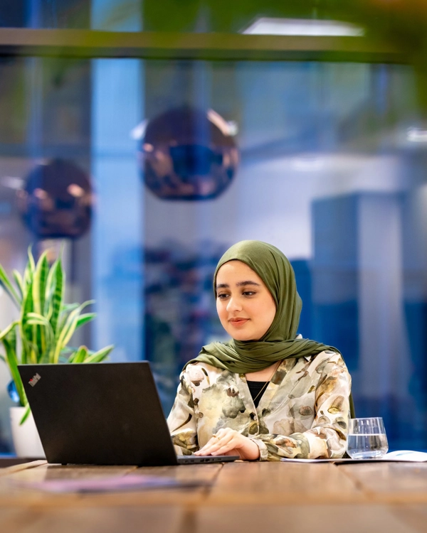 person sitting in front of laptop from CIL person sitting in front of laptop from CIL